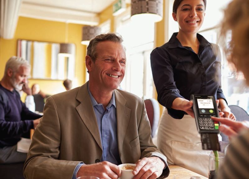 girl paying for meal